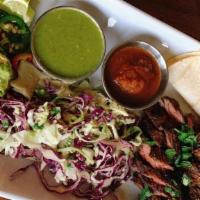 Street Tacos · Build your own Tacos, consisting of a corn tortillas, dressed cabbage, pickled red onions, c...