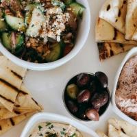 Mezze Platter · Dish is served with Baba Ghanoush, Hummus, Isreali Salad with Whipped Feta and Dukkah, Marin...