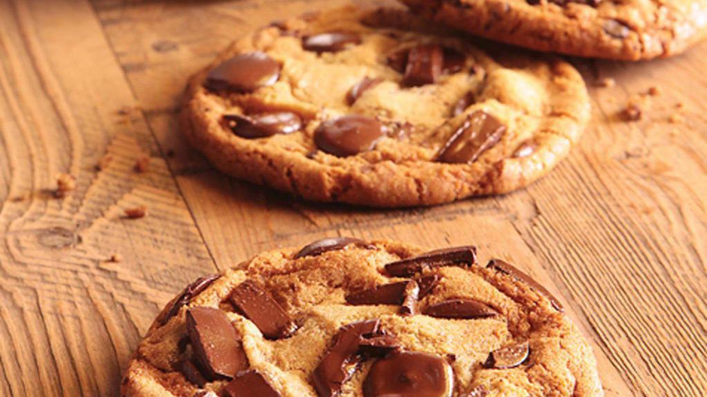 Chocolate Chunk Cookie · Overflowing with intensely flavorful chunks and morsels of sustainable chocolates grown in the Peruvian Andes - milk, semisweet and dark coins – and an added crunch of savory pretzel bites. A brown butter, caramelized, chewy-crisped-edged wonder to shower your taste buds with amazement.