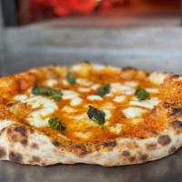 Margherita Pizza · Hand stretched dough topped with signature pizza  sauce,  olive oil, parmesan cheese, fresh ...