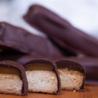 Gluten-Free Crunchies · Six pack. Crunchy gluten-free cookie layered with buttery vegan caramel and hand-dipped in s...