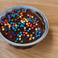 Cosmic Brownie · Fudgey Chocolate brownie w/ chocolate frosting and rainbow sprinkles