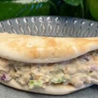 Chickpea Salad · Delicious chickpea salad with celery, onions, and capers. Comes with two pita breads or a sm...