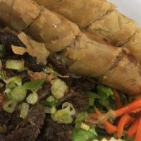 Grilled Pork Vermicelli · Grilled marinated pork over rice vermicelli noodles and vegetables with egg roll.