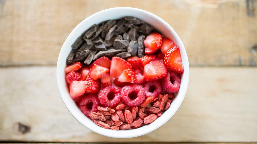 Aphrodite - Vanilla Yogurt · Vanilla greek yogurt, strawberries, raspberries, goji berries, semi-sweet chocolate chunks and raw honey.