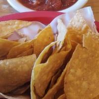 Chips Y Salsa · House red salsa | house made chips.