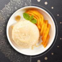 Mango And Sticky Rice · Whole mango served with sweet coconut sticky rice.