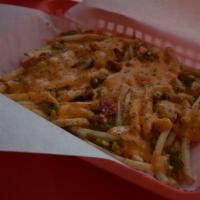 Green Chile Cheese Fries · Our Garlic Seasoned Fries topped with Roasted Green Chile and Cheddar Cheese Sauce.
