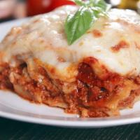 Meat Lasagna · Generous Portion of our Meat Lasagna, served with two pieces of Garlic Toast
