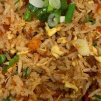 Pork Fried Rice · Stir fried rice with egg, peas, carrots and our signature bbq pork.