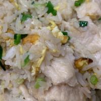 Chicken Fried Rice · Stir fried rice with egg, peas, carrots and chicken.