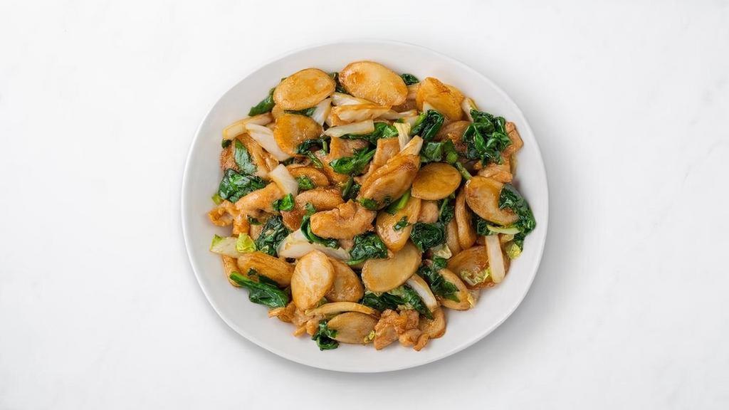 Shanghai Rice Cakes With Chicken · Chewy rice ovalettes are sauteed with premium chicken, crunchy cabbage, fresh spinach, and a blend of soy sauce and house seasonings. Finished with a drizzle of sesame oil to add a rich, umami flavor.