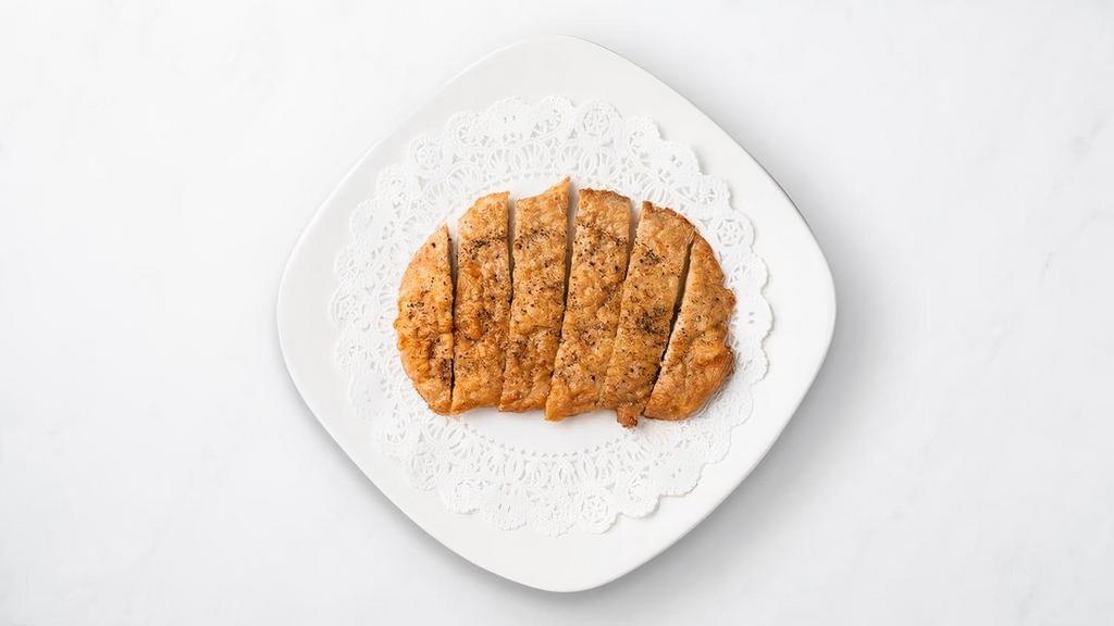 Fried Pork Chop · Each pork chop cutlet is fried to perfection and garnished with freshly ground coarse pepper. Golden on the outside, juicy on the inside.