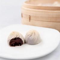 Chocolate & Mochi Xiao Long Bao (5 Each) · Decadent, premium chocolate truffle enveloped in a thin layer of mochi—wrapped with painstak...