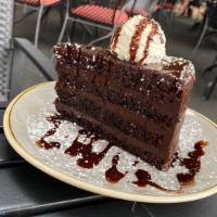 Chocolate Cake · Gluten Free, Vegetarian | Bourbon Vanilla Whipped Cream, Chocolate Sauce, Powdered Sugar