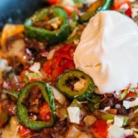 Santa Fe Nachos · Chips, black beans, Jack cheese, grilled bell peppers, grilled onions,fresh fried jalapeños,...