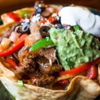 Deluxe Taco Salad · Lettuce, cheese, sour cream, guacamole, tomatoes, and onions. Choice: Steak, or Prawns Fajit...