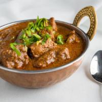 Lamb Curry · Gluten-free. Boneless lamb cooked with onions, garlic ginger, tomatoes and curry spices.