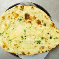 Butter Naan · Traditional bread made with leavened dough flavored with butter.