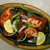 Chicken Tandoori · Six pieces. Chicken on-the-bone marinated in yogurt and spices cooked in a tandoor and serve...