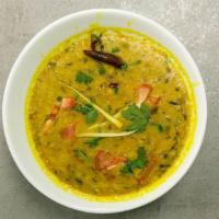 Yellow Dal · Vegan. Yellow lentils, cumin seeds, onion, garlic, and curry leaves.