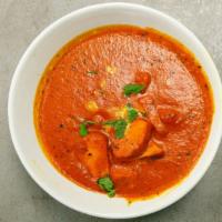Chicken Tikka Masala · Chicken breast pieces cooked with spices in creamy tomato butter sauce.