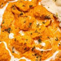 Butter Chicken · Chicken cooked in a mild buttery curry sauce with fenugreek.