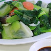 Steamed Mixed Vegetables · Varieties of fresh vegetables, including Chinese broccoli, green cabbage, broccoli crowns, b...