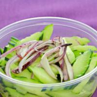 Mini Cucumber Salad · Slices of fresh cucumbers with sprinkled fresh red onions in a clear Thai dressing.