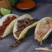 Tacos · Your choice of meat served inside a traditional corn tortilla with onions, cilantro, limes, ...