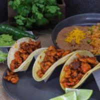 Taco Plate · Your choice of meat served inside 3 tacos made with traditional corn tortillas, as well as r...