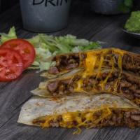 Quesadillas · Your choice of meat and melted cheddar cheese served inside a flour tortilla with a fried ja...