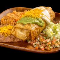 Chimichanga Plate · Shredded beef or chicken burrito, deep fried, and topped with guacamole, sour cream, cheese,...