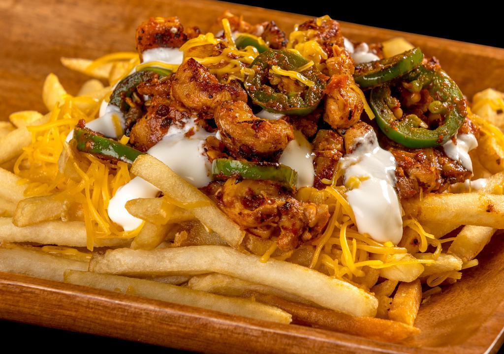 Cowboy Fries · Grilled chicken, jalapeños, red sauce, sour cream, white cheese.
