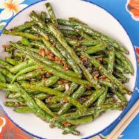 Garlic Green Beans · Green beans sautéed with garlic, soy sauce, and white pepper.
