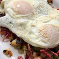Corned Beef Hash · Homemade corned beef slow cook for hours and toss on the griddle with chopped potatoes and o...