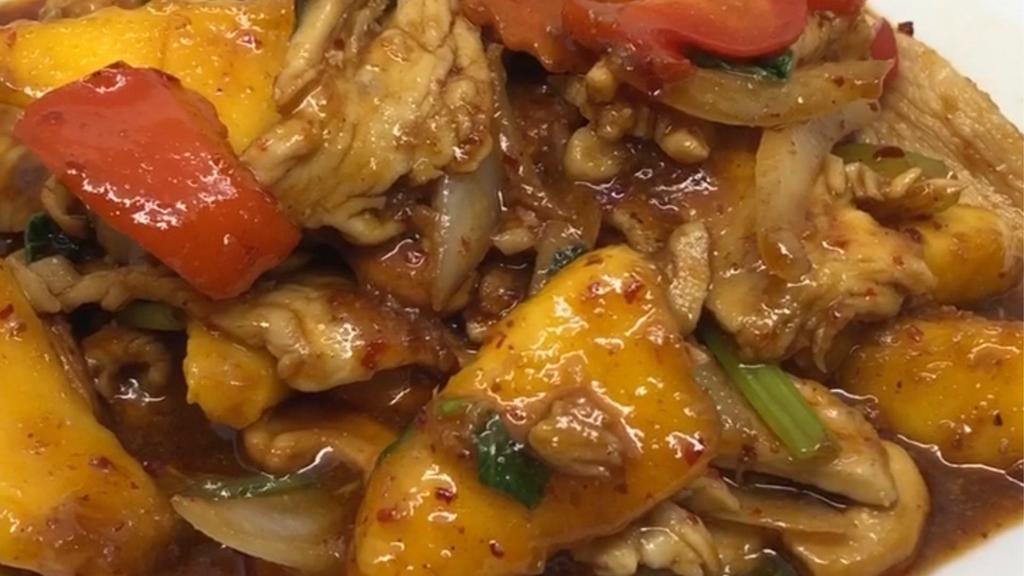 Stir Fried Mango · Choice of meat or vegetarian sautée with fresh mango, bell pepper, white onion, green onion, cashew nuts, carrot, and basil.