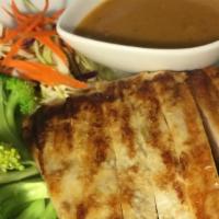 Lemongrass Chicken · Grilled chicken breast with steamed spinach, broccoli, carrot, cabbage, and peanut sauce.