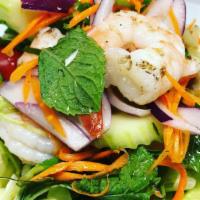 Bangkok Shrimp Salad  · Grilled prawns with lemon glass, cucumber, carrot shredded, tomatoes, green onion, red onion...