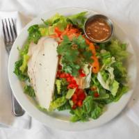 Sesame Chicken · Romaine, chicken, cabbage, carrots, green onions, cilantro, red peppers, mandarin oranges an...