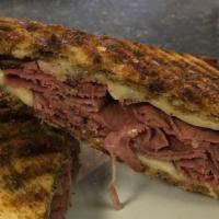 Reuben Panini (Whole) · Pastrami, sauerkraut, swiss cheese and house made 1000 dressing on marble rye grilled to cri...