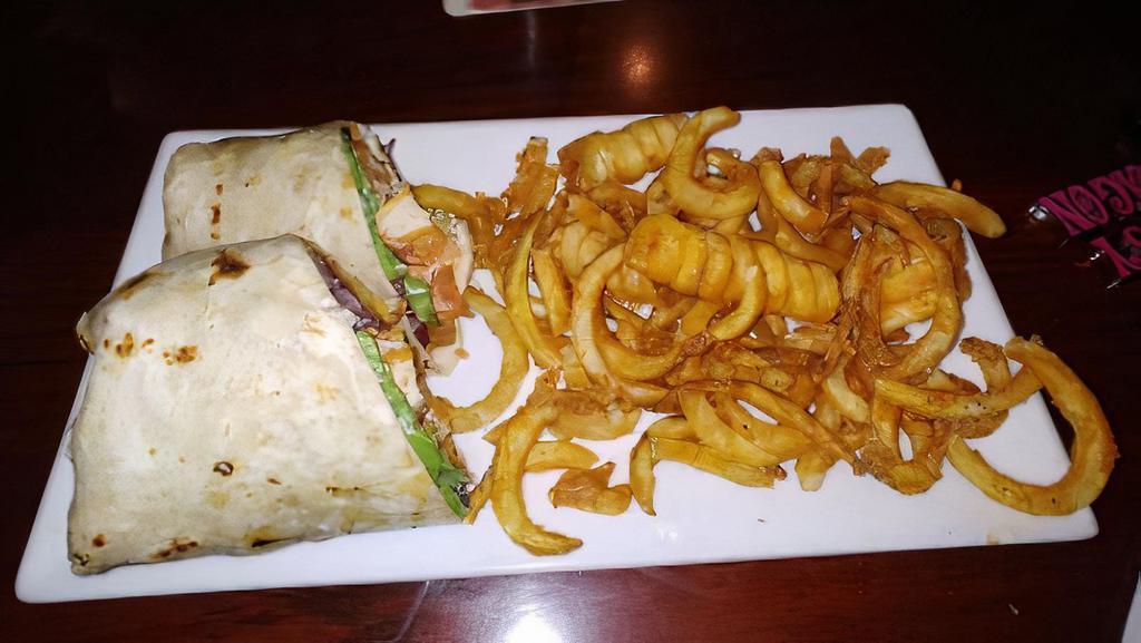 Mango Habanero Chicken Wrap · Crispy chicken, lettuce, tomato, and jack cheese all tossed in a mango habanero sauce then wrapped in a grilled tortilla.