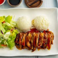 Chicken Teriyaki · Grilled chicken with marinated teriyaki sauce. Choice of meat served with rice and salad.