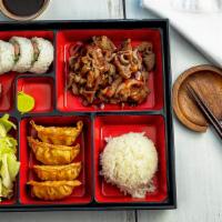 Beef  Bento · Served with rice, salad, gyoza and California roll in a bento box.