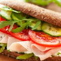Turkey Sandwich · Flavorful sandwich with turkey, lettuce, tomato, mayo, house seasonings, on amoroso roll.