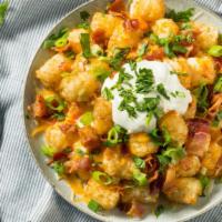 Loaded Tots · Delicious basket of tater tots with cheese, steak, green chili or red chili.