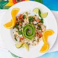 Ceviche · Shrimp cooked in lime juice, mixed with cilantro, onions, tomatoes, cucumbers, avocado and j...