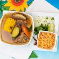 Caldo De Res · Chunks of tender beef in a clear broth cooked with vegetables served with rice and tortilla.