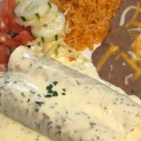 Enchiladas De Espinacas · Baby fresh spinach sautéed with onions, mushrooms, tomatoes and spices topped with cream sau...