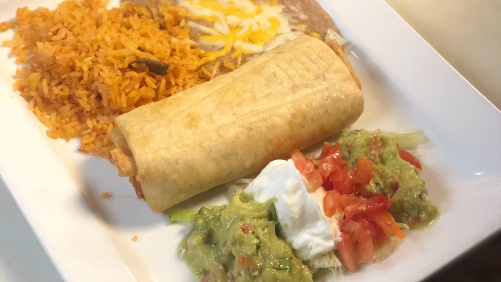 Arizona Chimichanga · A large flour tortilla deep fried with your choice of meat and filled with cheese inside. Garnished with lettuce, sour cream and gaucamole and served with rice and beans.